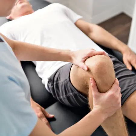 male guy patient, knee massage